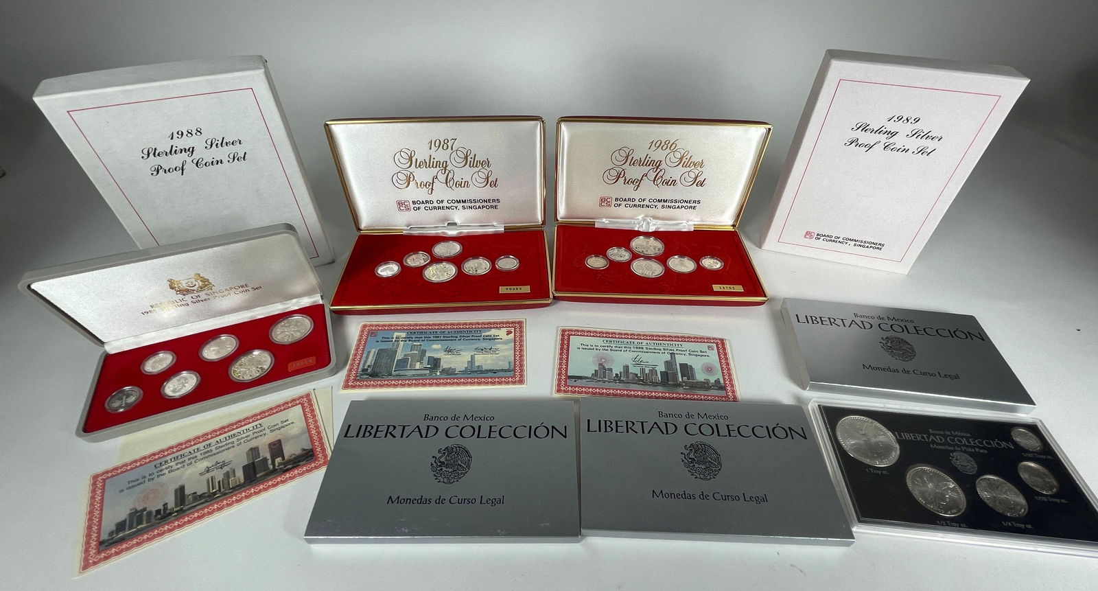 8 STERLING SILVER PROOF COIN SETS FROM MEXICO AND SINGAPORE (1 of 7)