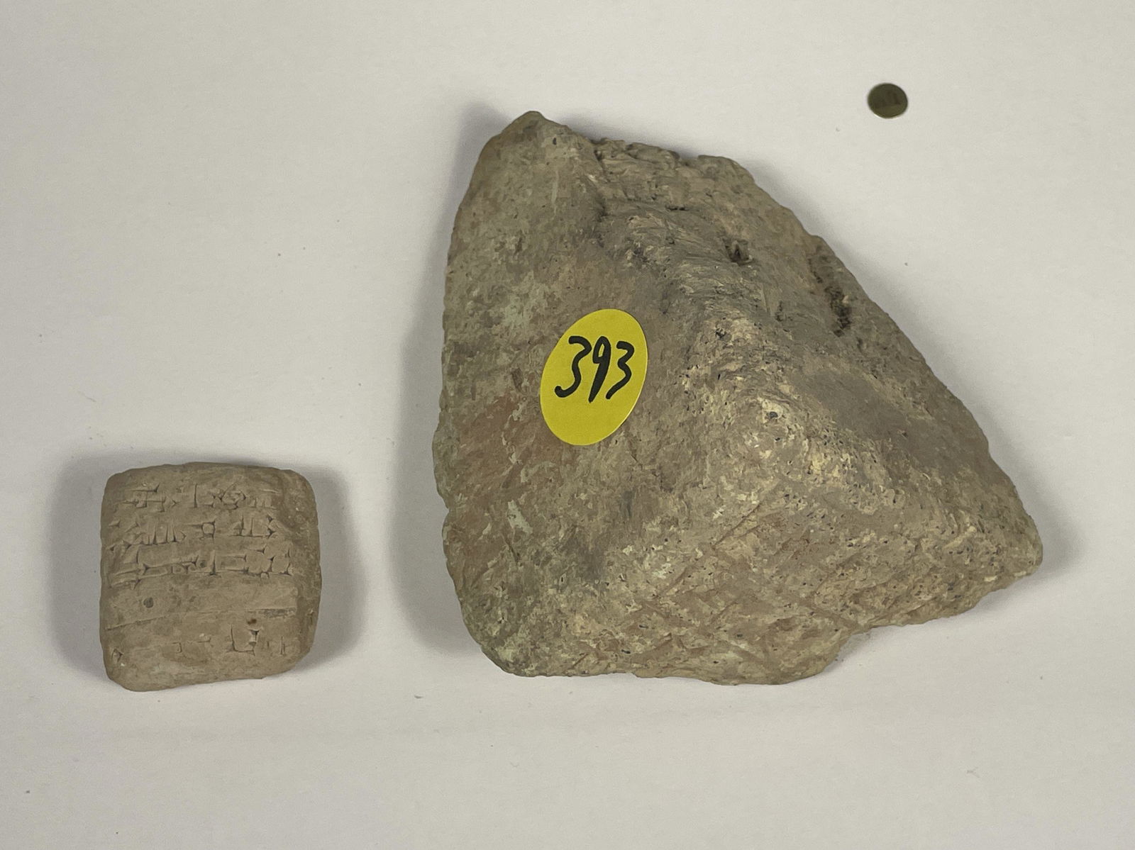 A CUNEIFORM TABLET FRAGMENT TOGETHER W/ ANOTHER TABLET FRAGMENT, 3" X 3" X 2" AND 1" X 1" X .5" (1 of 11)