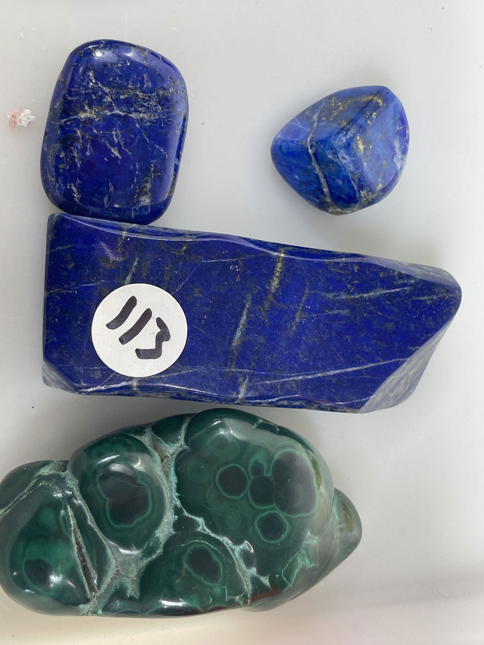 THREE PIECES LAPIS LAZULI AND ONE PIECE BULLSEYE MALACHITE, 4" X 2", 3" X 2", 1.5", AND 1": THREE PIECES LAPIS LAZULI AND ONE PIECE BULLSEYE MALACHITE, 4" X 2", 3" X 2", 1.5", AND 1"