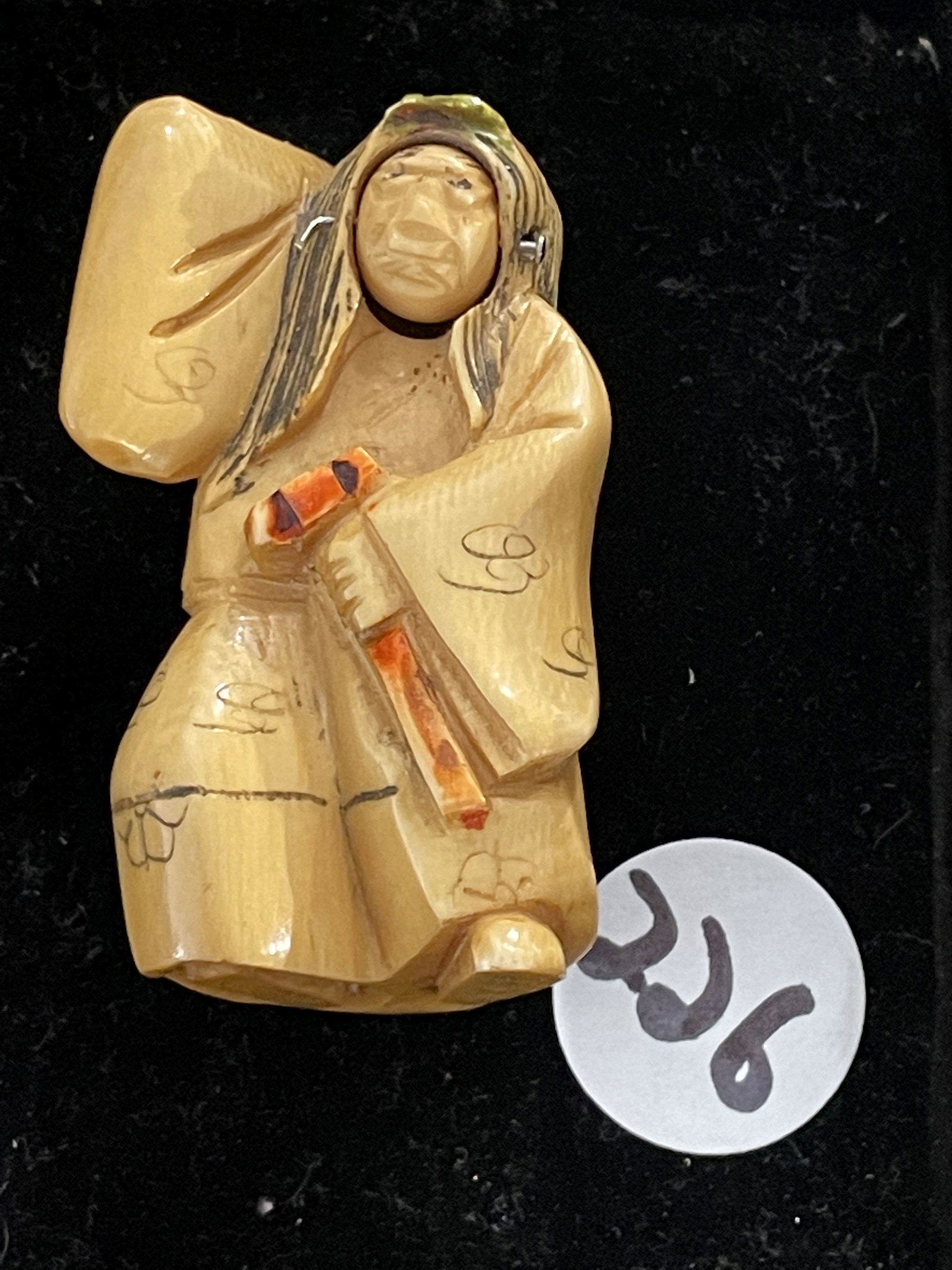 ARTIST SIGNED JAPANESE NETSUKE FIGURE WITH A ROTATING FACE: ARTIST SIGNED JAPANESE NETSUKE FIGURE WITH A ROTATING FACE, 2.25" X 1"