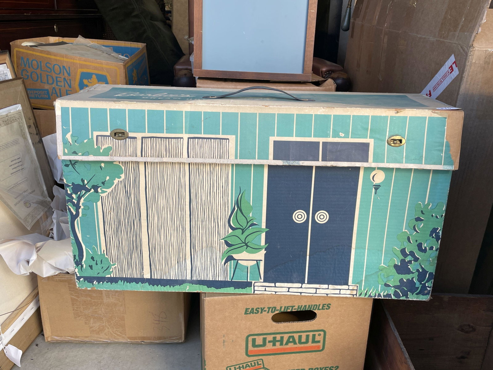 A CARDBOARD 1960S BARBIE DREAMHOUSE. APPEARS COMPLETE WITH ACCESSORIES: A CARDBOARD 1960S BARBIE DREAMHOUSE. APPEARS COMPLETE WITH ACCESSORIES, 25" x 8" x 14"