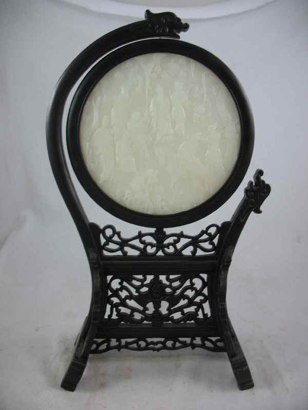 LARGE CARVED JADE DISK W/ CARVED TEAK HOLDER : LARGE CARVED JADE DISK W/ CARVED TEAK HOLDER / DISK IS 6.5", TOTAL HEIGHT IS 15.5" T
