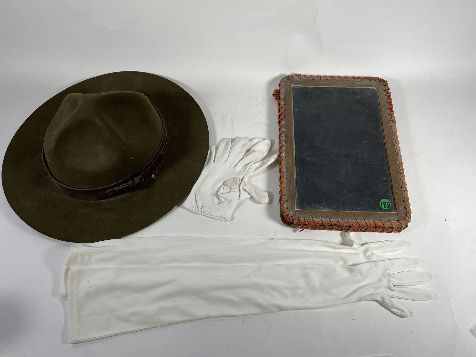 A WWI CAVALRY HAT, A CHALKBOARD, AND GLOVES (1 of 4)