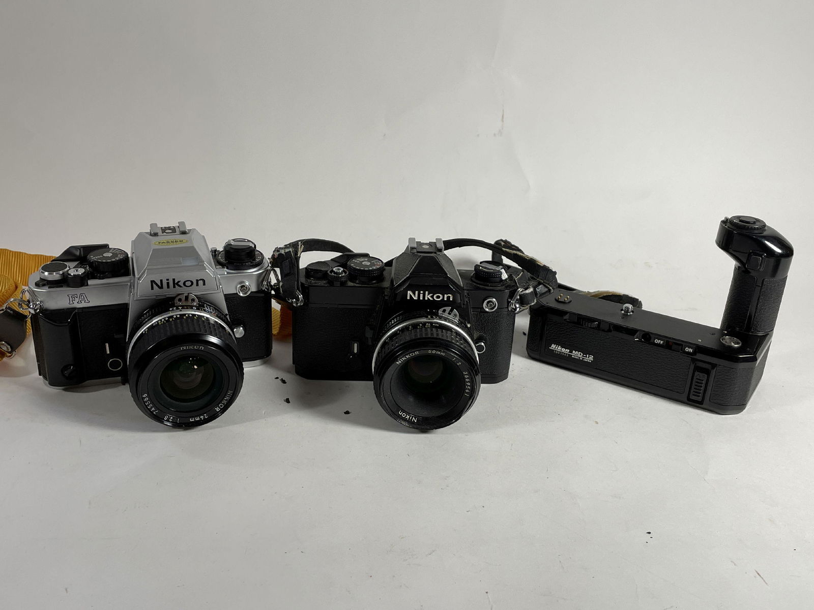 A NIKON FA AND A NIKON FM WITH MOTOR DRIVE AND TWO LENSES (1 of 8)