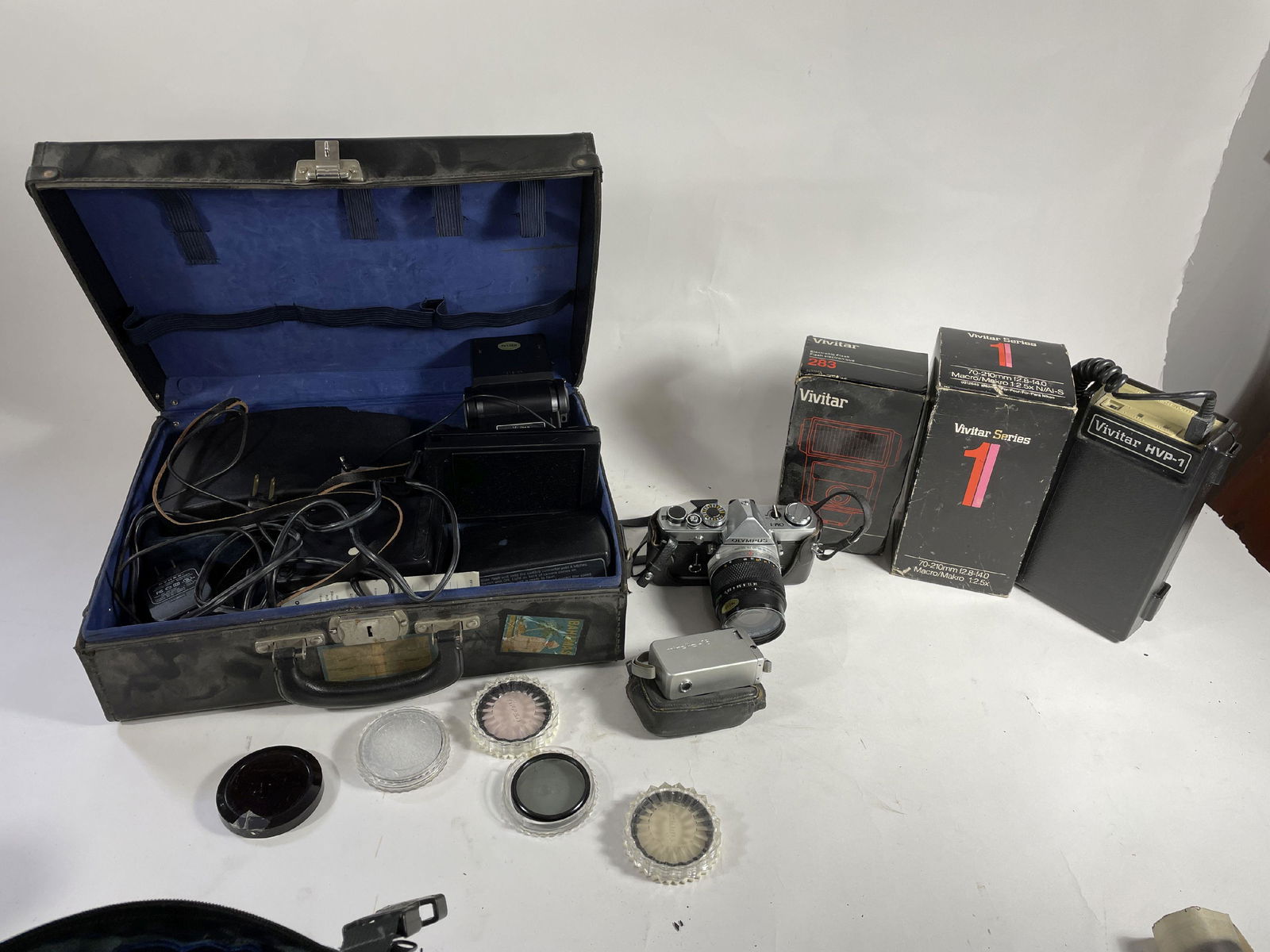 AN OLYPUS OM1, A MINOLTA 16, AND MISCELLANEOUS LENSES AND FLASHES (1 of 5)