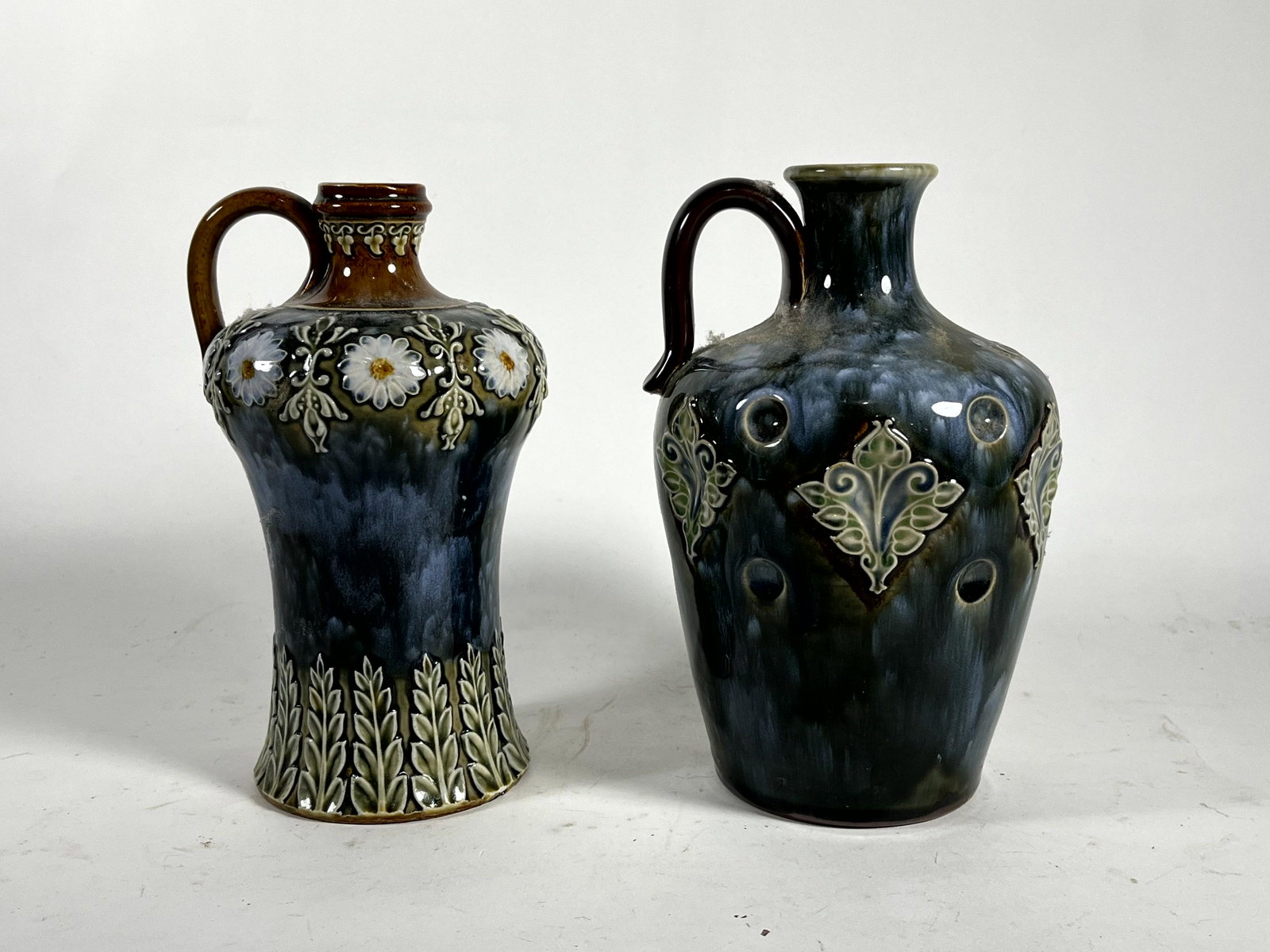 TWO ROYAL DOULTON ART NOUVEAU STONEWARE LIQOUR JUGS, 8.5" AND 9" TALL (1 of 6)