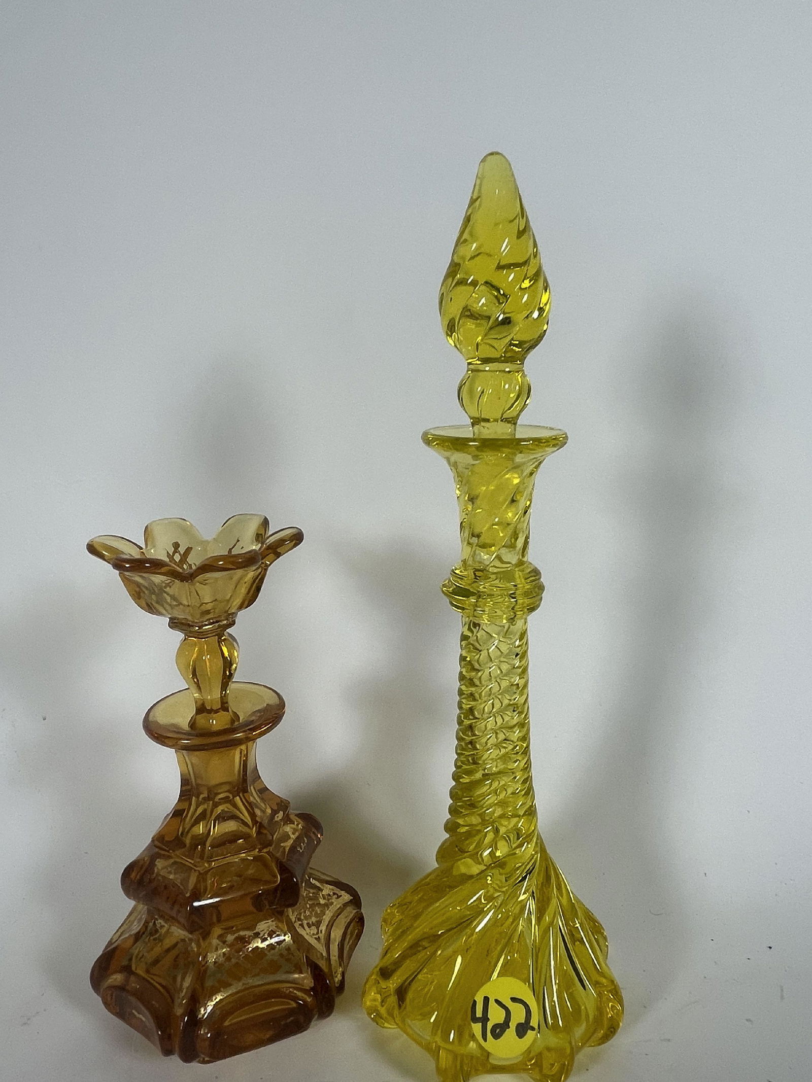 AN EARLY VASELINE GLASS PERFUME AND A GOLD PAINTED AMBER PERFUME, 10" AND 6" (1 of 7)