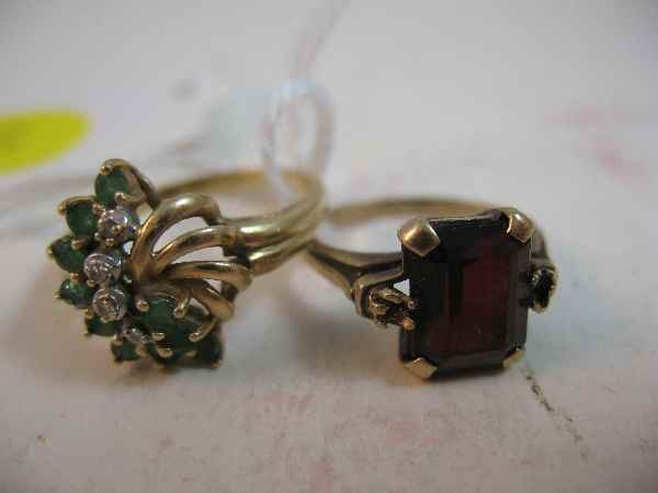 2 RINGS: 10 K GOLD W/ GARNET (2.8 G) & 14 K G: 2 RINGS: 10 K GOLD W/ GARNET (2.8 G) & 14 K GOLD W/ EMERALDS & DIAMONDS (3.4 G)