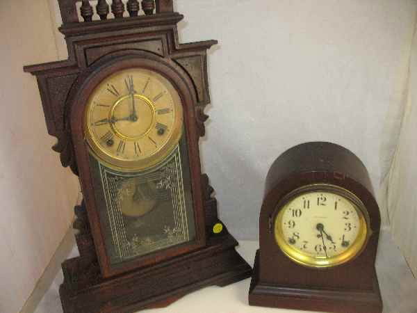 A SETH THOMAS CLOCK AND AN ELI TERRY CLOCK: A SETH THOMAS CLOCK AND AN ELI TERRY CLOCK. COMPLETE