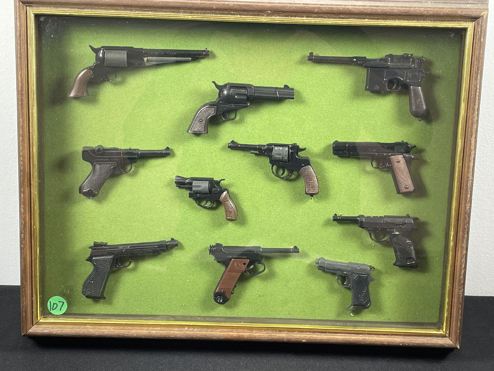 SHADOWBOX CASE OF ELEVEN MODEL GUNS BY MARX (1 of 5)