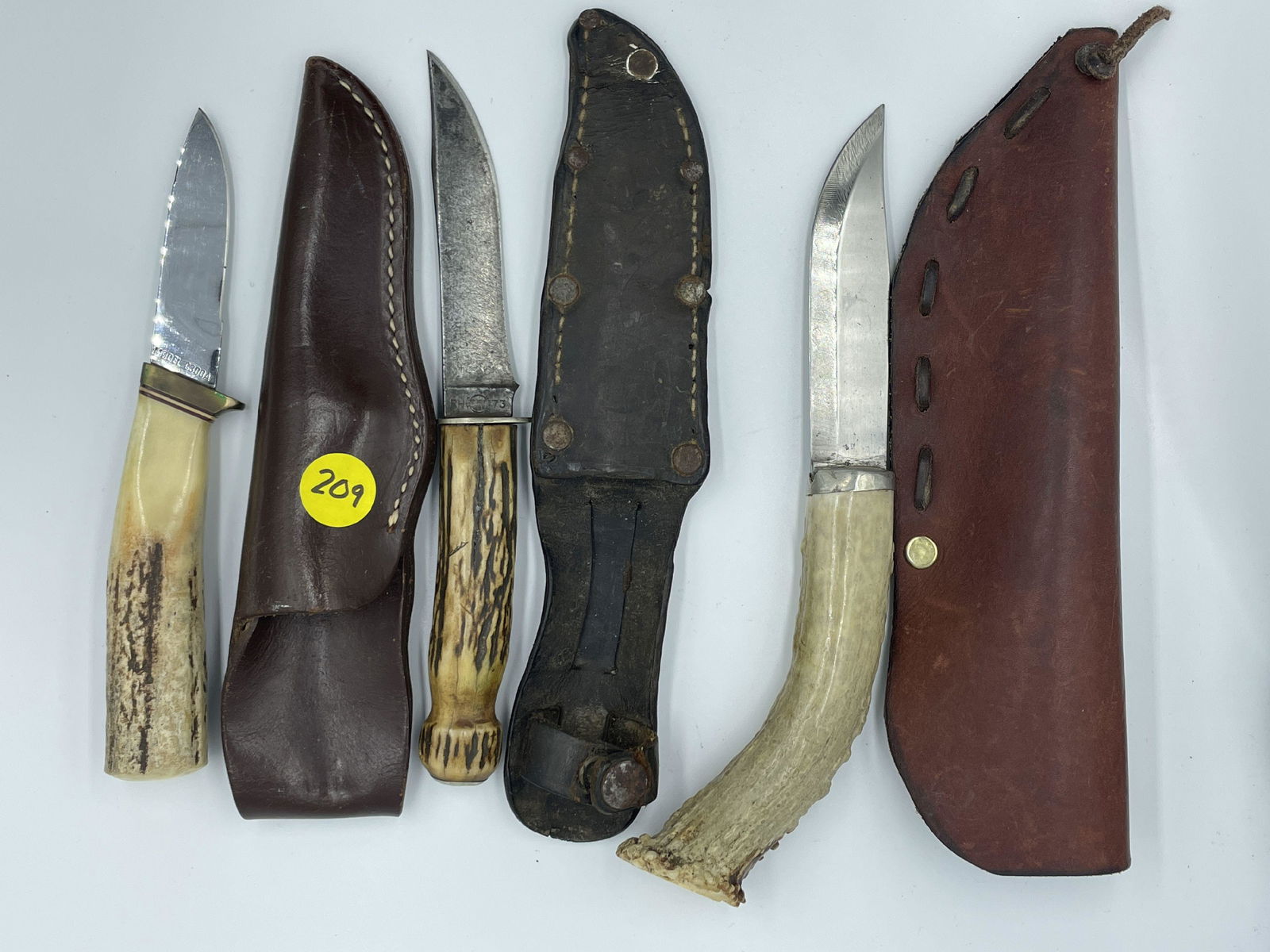 THREE STAG-HANDLED KNIVES WITH LEATHER SHEATHS. ONE GERBER, ONE REMINGTON, ONE UNMARKED. 9.5" AND (1 of 10)