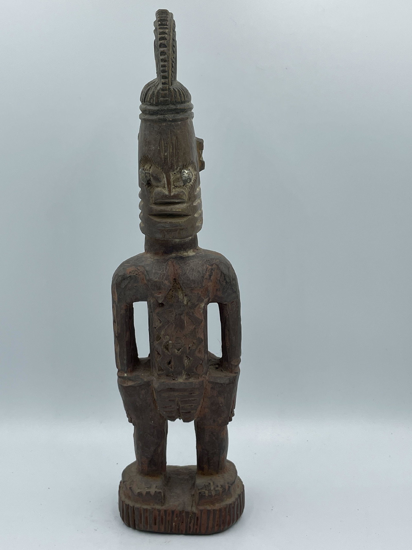 A FEMALE YORUBA ERE IBEJI FIGURE WITH PAINT, 11" PROPERTY FROM THE PRIVATE COLLECTION OF JANINE AND: A FEMALE YORUBA ERE IBEJI FIGURE WITH PAINT, 11" PROPERTY FROM THE PRIVATE COLLECTION OF JANINE AND JOSEF GUGLER. SEE ALSO THE WILLIAM BENTON MUSEUM OF ART COLLECTION OF AFRICAN ART.