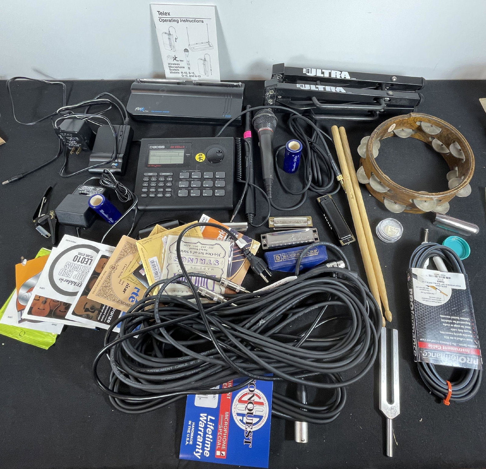 A BOSS DR-550 MK2 WITH MICROPHONES, STRINGS, AND OTHER MUSICAL ITEMS: A BOSS DR-550 MK2 WITH MICROPHONES, STRINGS, AND OTHER MUSICAL ITEMS