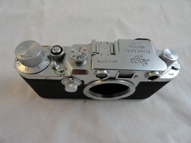 LEICA IIIC CAMERA: Leica IIIc camera This camera is in perfect working order. Shutter speeds are accurate, curtain great shape. Focus and finder are bright. The top plate has some pitting and chrome loss but the rest of