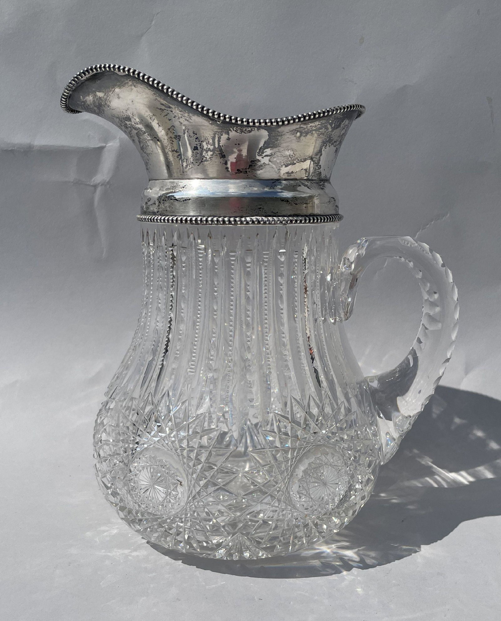 A SILVER MOUNTED CUT CRYSTAL WATER PITCHER, 8" X 6" X 10" (1 of 7)