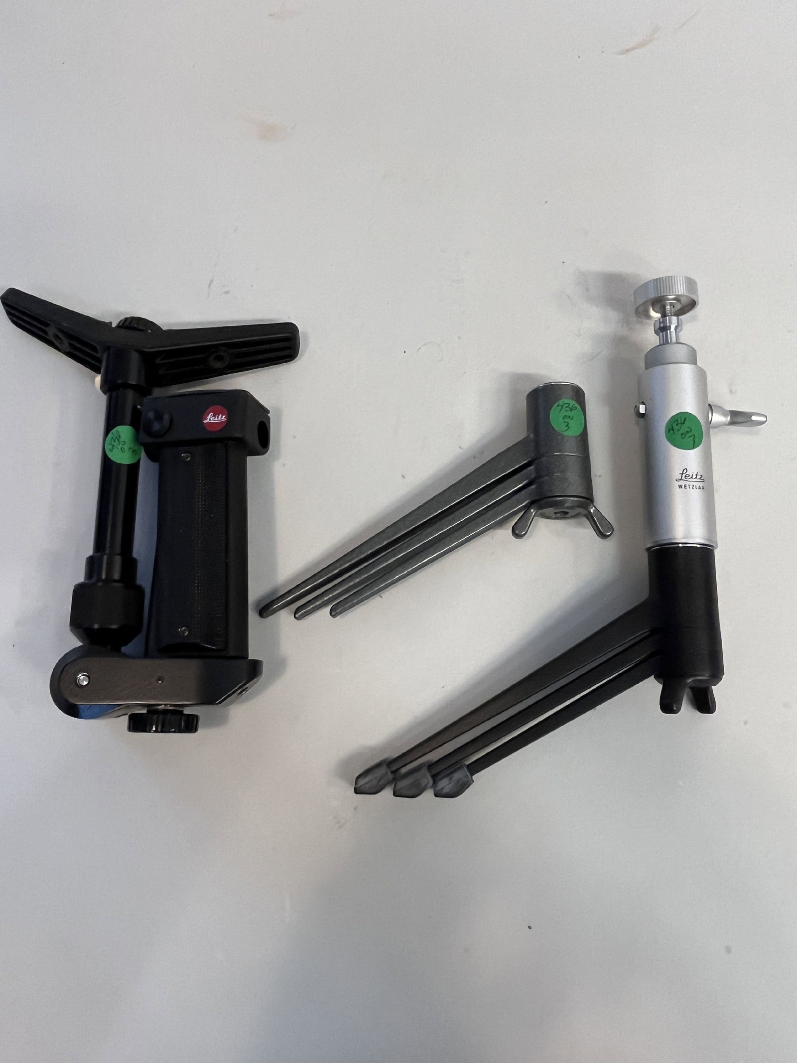 LEICA LOT: 2 MINI TRIPODS, ONE HEAD, ONE SHOLDER GRIP (1 of 1)