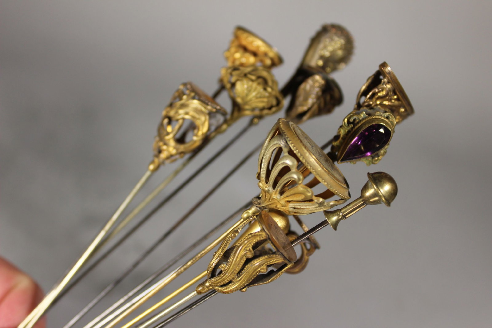 LOT: 12 VICTORIAN GOLD FILLED HATPINS, ONE HAVING STONES, ONE ART NOUVEAU, LONGEST 12", GOOD (1 of 5)