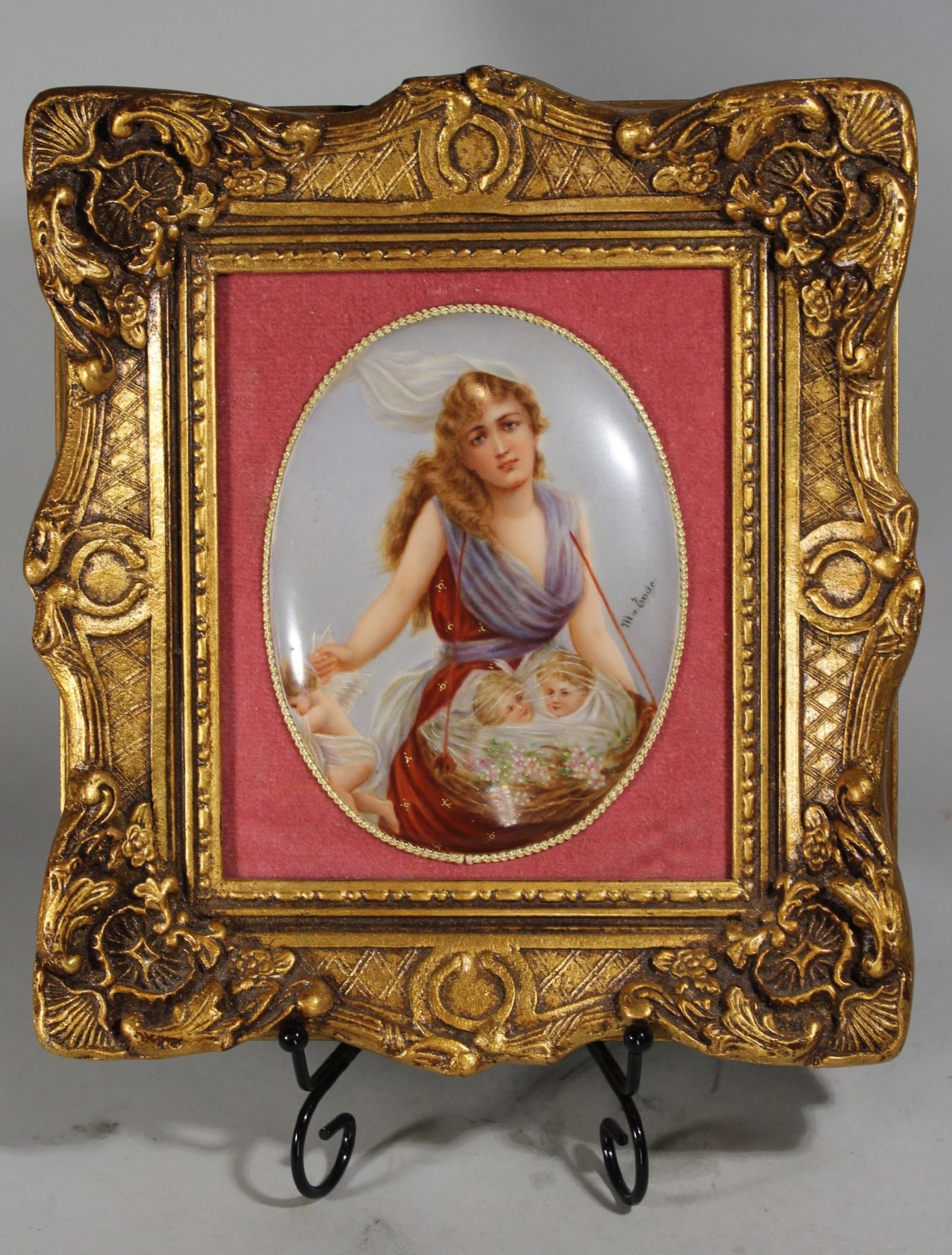 SIGNED CONVEX PORCELAIN PLAQUE, WOMAN WITH CHERUBS IN BASKET, FRAME 10" x 9 1/2", PORCELAIN 6" x 4: SIGNED CONVEX PORCELAIN PLAQUE, WOMAN WITH CHERUBS IN BASKET, FRAME 10" x 9 1/2", PORCELAIN 6" x 4 1/2", SIGNED, "MME EYDE".