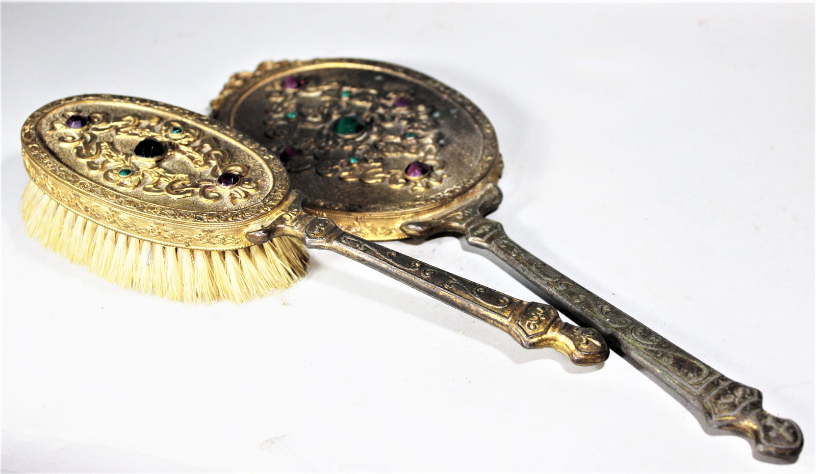TWO PIECE BEJEWELED HAND MIRROR AND BRUSH, 14" LONG THE MIRROR.: TWO PIECE BEJEWELED HAND MIRROR AND BRUSH, 14" LONG THE MIRROR.