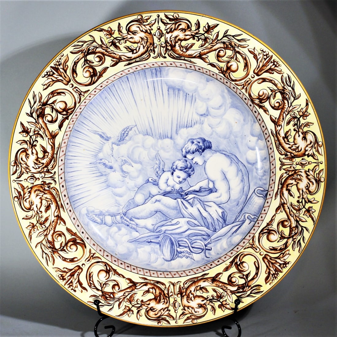 SARREGUEMINES FAIENCE CHARGER DEPICTING HERMES & CUPID, 16" DIAMETER, 19TH C.: SARREGUEMINES FAIENCE CHARGER DEPICTING HERMES & CUPID, 16" DIAMETER, 19TH C.