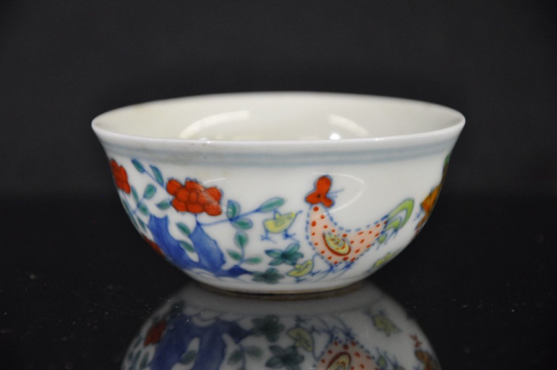 19TH C CHINESE FAMILLE ROSE WINE CUP: Famille rose win cup, later 19Th/20Th c. decorated with a rooster and a chicken playing in a garden. six Chinese characters marked on base. 1.5"T 3.25"D