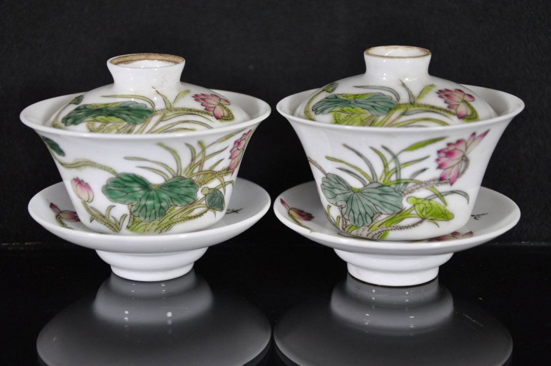 19/20TH C. PAIR OF CHINESE FAMILLE ROSE CUPS: Porcelain tea cups, decorated with lotus flowers and some Chinese characters, six Chinese characters marked on cover. 3.25"T with all three pieces.