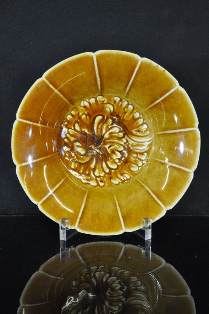 CHINESE BROWN GLAZE PORCELAIN PLATE: Porcelain plate with carved flower on middle of plate. 9"D