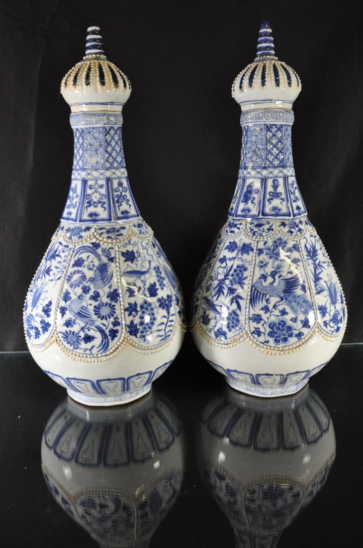 A PAIR OF CHINESE BLUE AND WHITE PORCELAIN VAS: Porcelain vases from China, decorated with a phoenix and other birds, middle eastern style, Chinese characters marked on base. 25.5"T