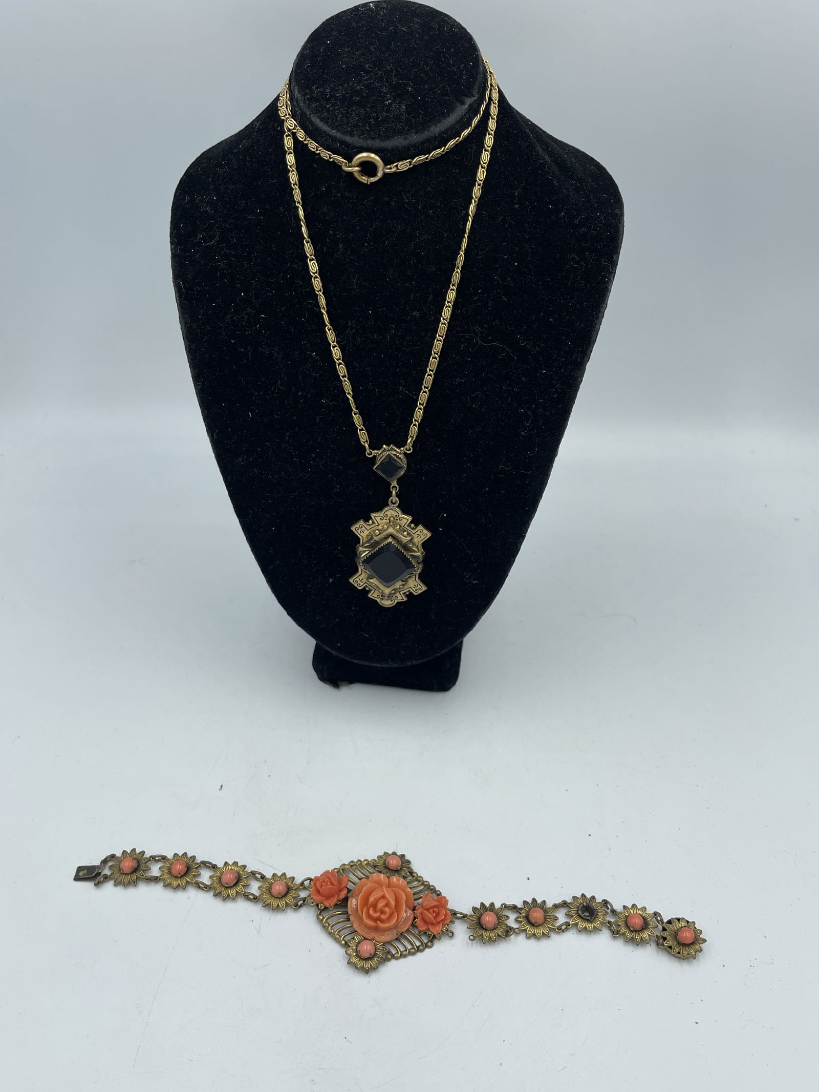 A PINK CORAL VICTORIAN BRACELET AND A JET GLASS PENDANT NECKLACE (1 of 4)