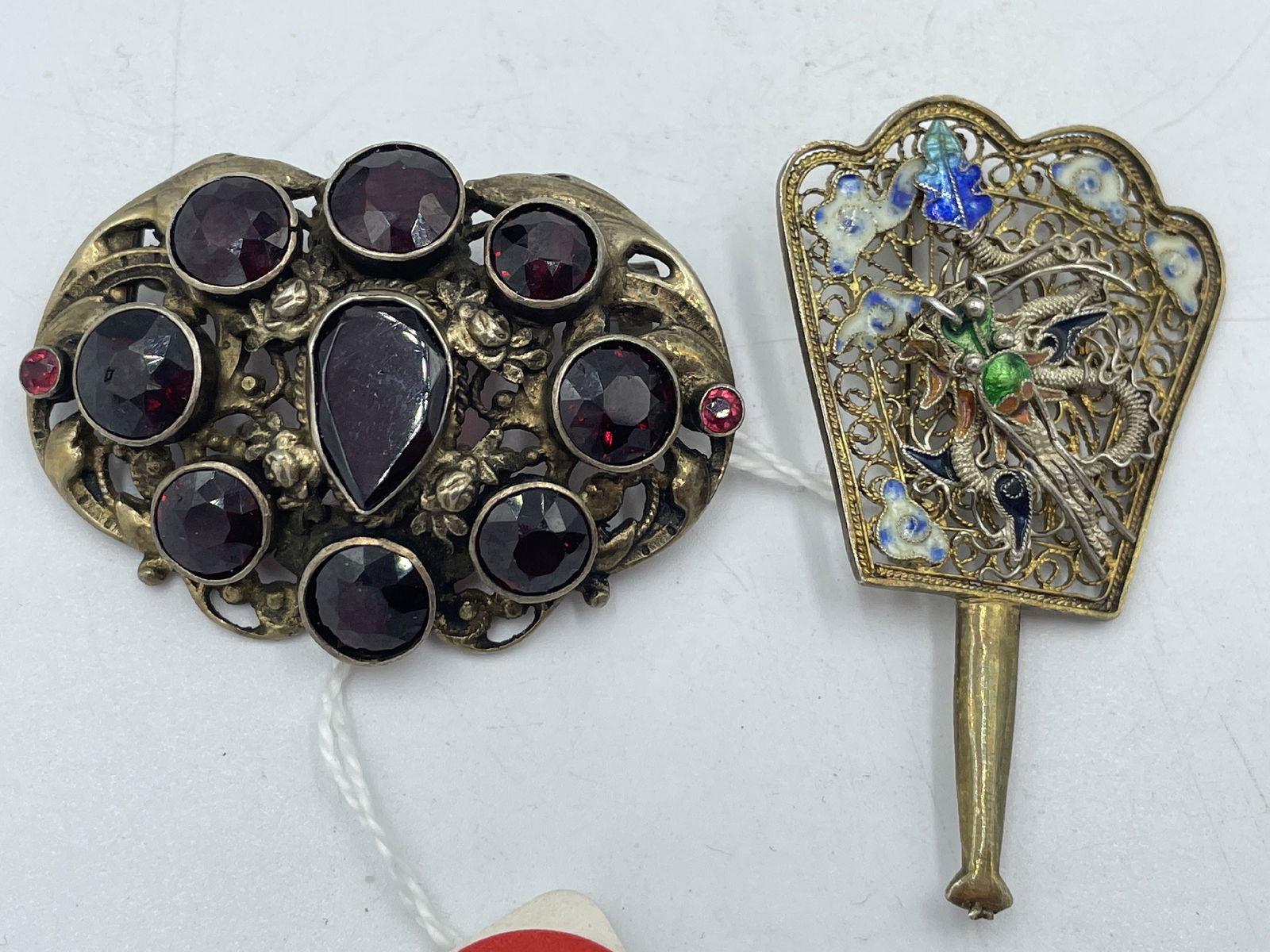 A GILT SILVER GARNET BROOCH AND AN ENAMELED PIN (1 of 4)