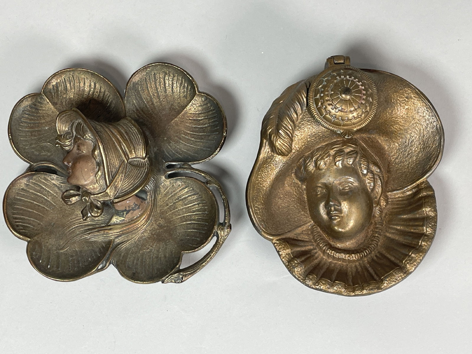 A PAIR OF FIGURAL CAST IRON INKWELLS, BOTH 6" X 6" X 2": A PAIR OF FIGURAL CAST IRON INKWELLS, BOTH 6" X 6" X 2"