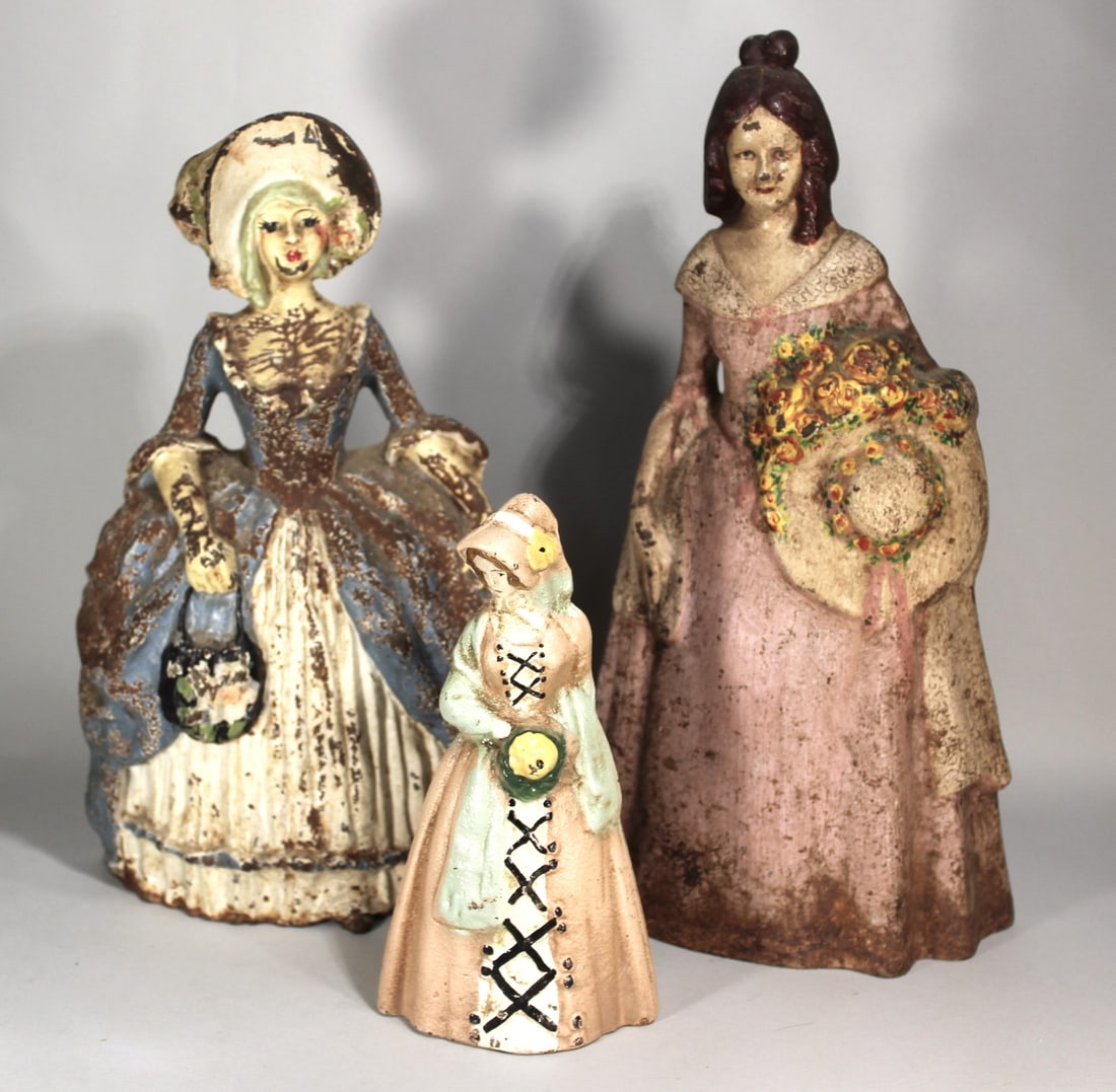 THREE CAST IRON DOORSTOPS WITH ORIGINAL PAINT 11.25" AND SMALLER (1 of 4)