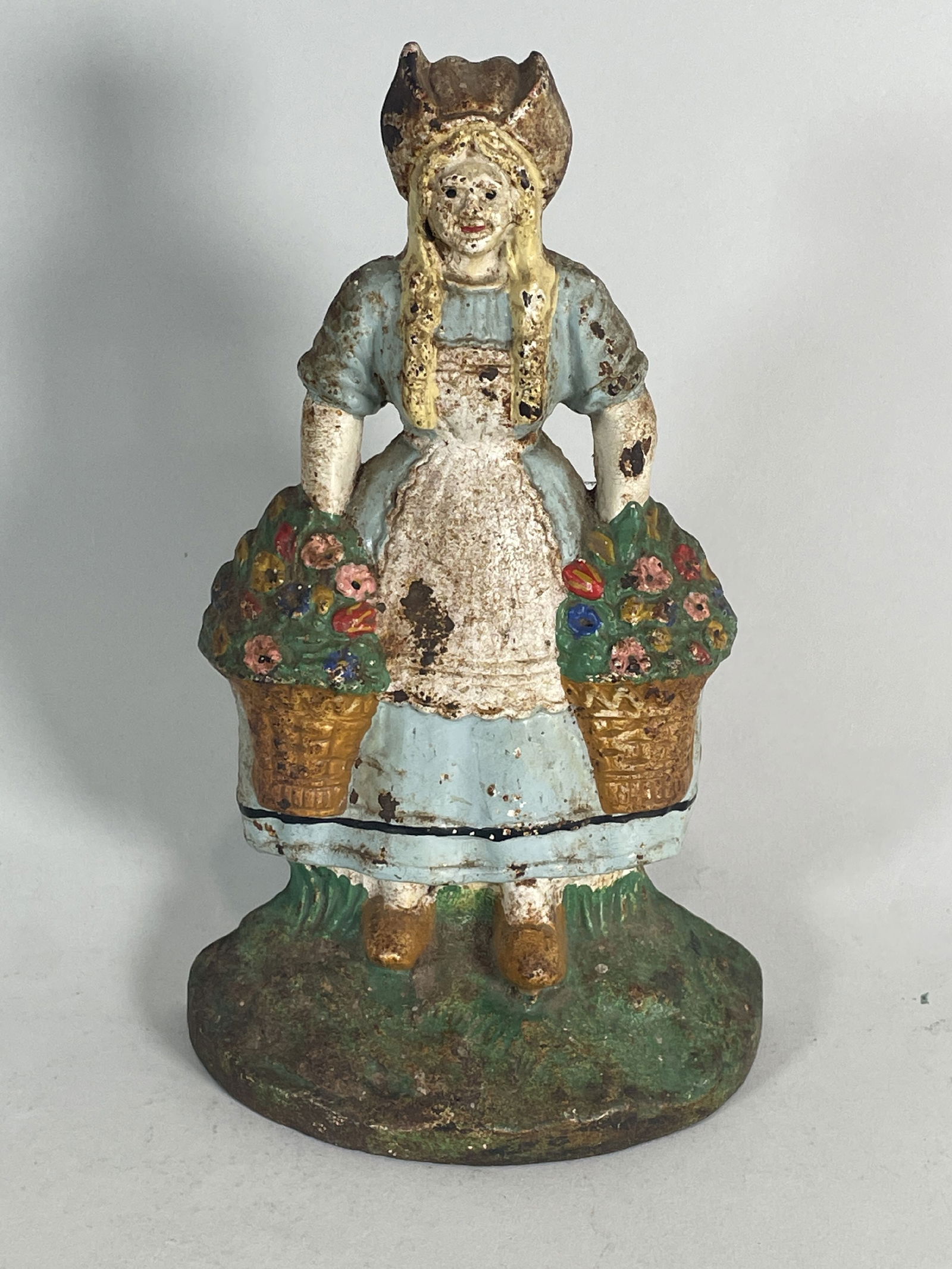ANTIQUE CAST IRON DOORSTOP: DUTCH GIRL WITH BASKETS 9.75" TALL (1 of 5)