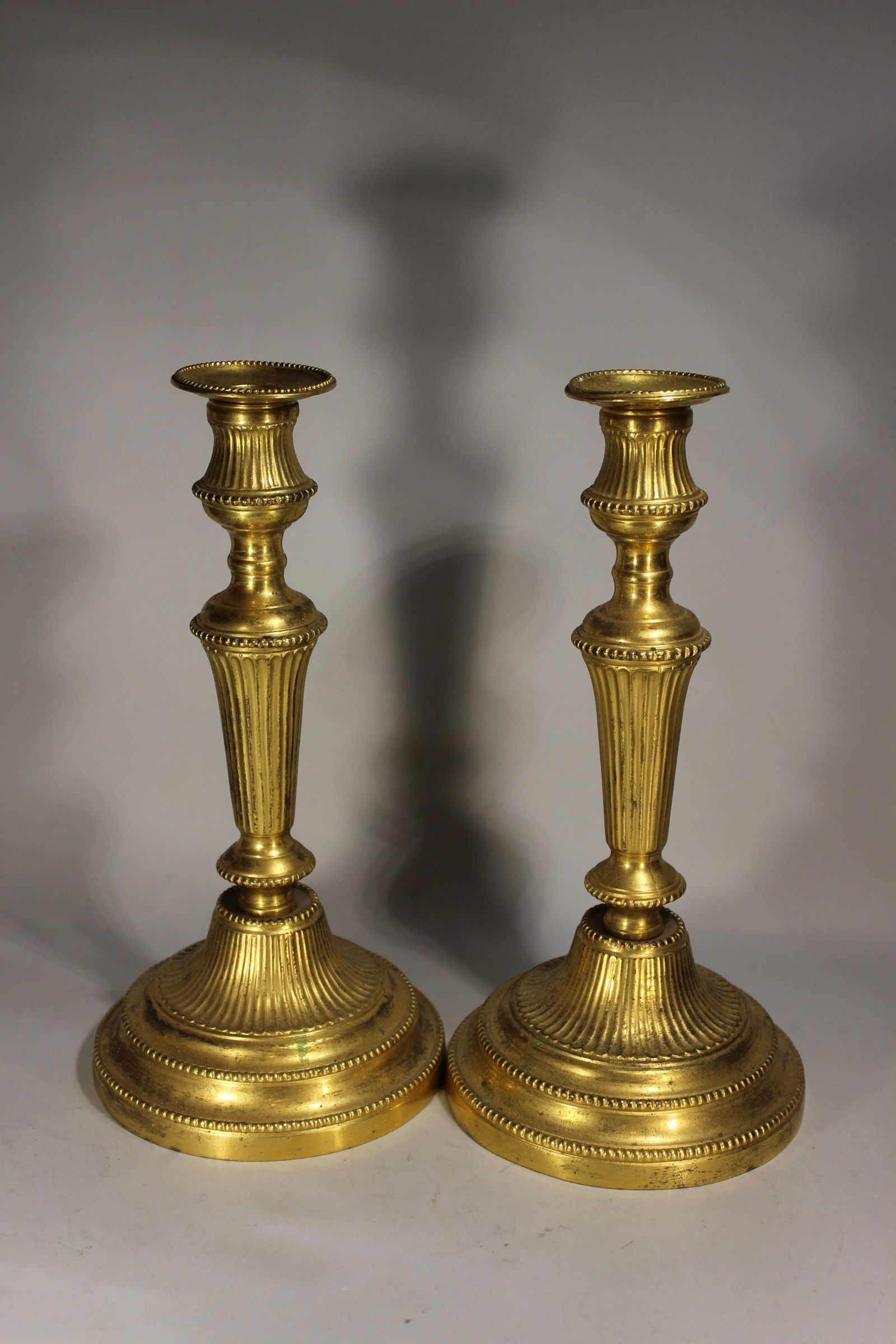 VERY EARLY PAIR GILT BRONZE CANDLE HOLDERS, 18TH CENTURY. 11" TALL X 5.5" (1 of 3)