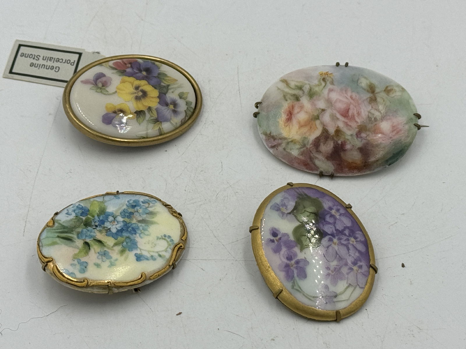 FOUR VICTORIAN FLORAL HAND PAINTED PORCELAIN PINS (1 of 4)