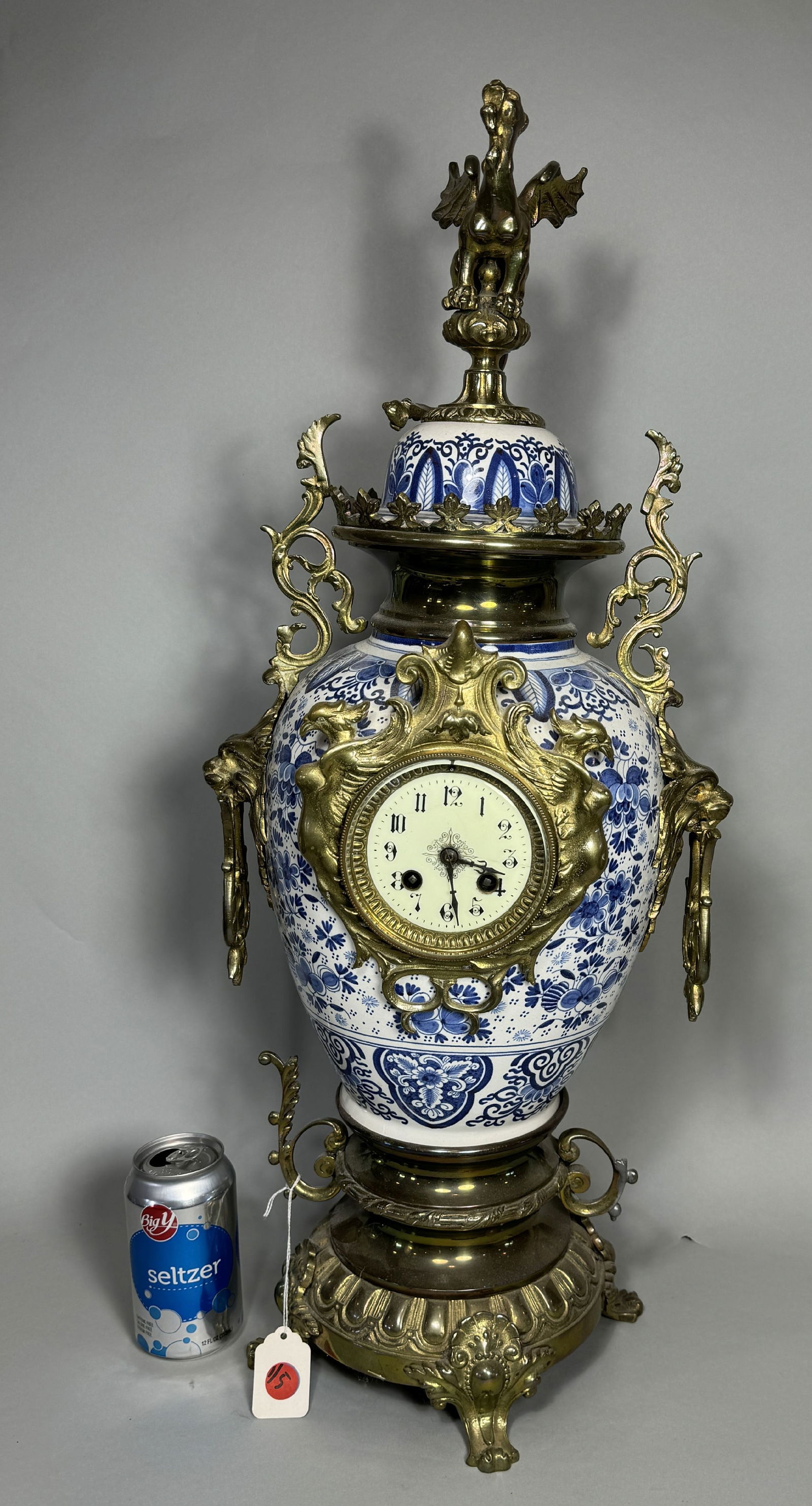 A 27" BRONZE MOUNTED DELFT CLOCK W/ GRIFFIN PHINEAL, 12" X 10" X 27" (1 of 8)