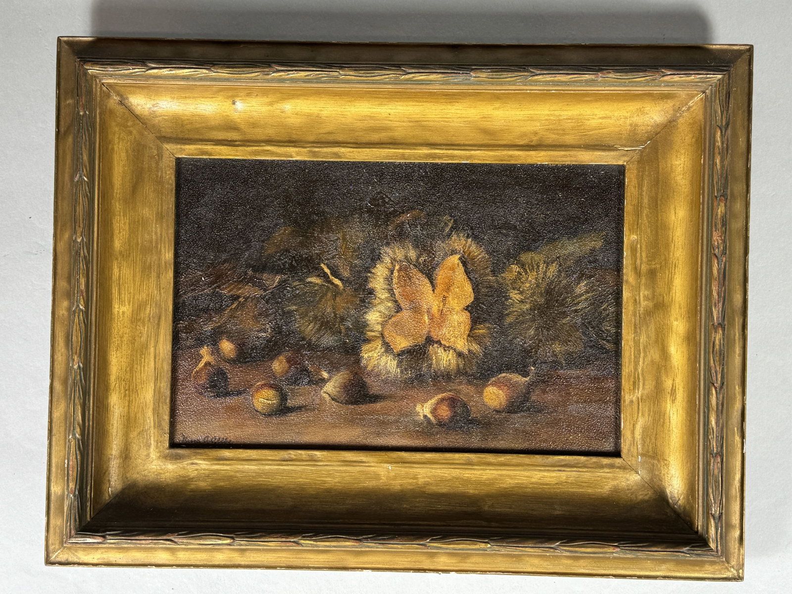 A STILL LIFE WITH ACORNS ON PANEL IN CARVED GILTWOOD FRAME SIGNED NINA A. ALLBE: A STILL LIFE WITH ACORNS ON PANEL IN CARVED GILTWOOD FRAME SIGNED NINA A. ALLBE, 13.5" X 11" FRAMED AND 9" X 6" SIGHT