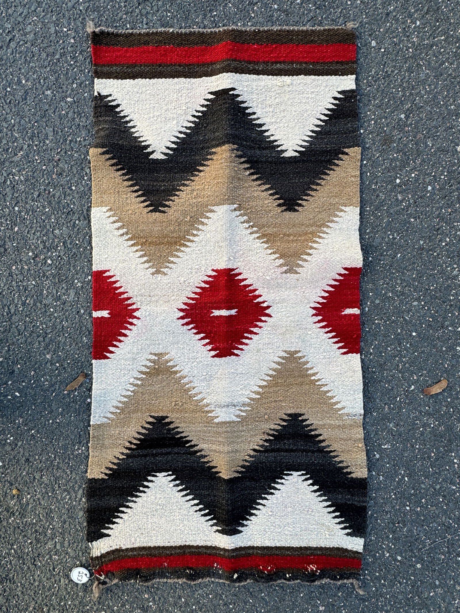 A SMALL 1930S NAVAJO RUG, 18.5" X 37.5" (1 of 2)