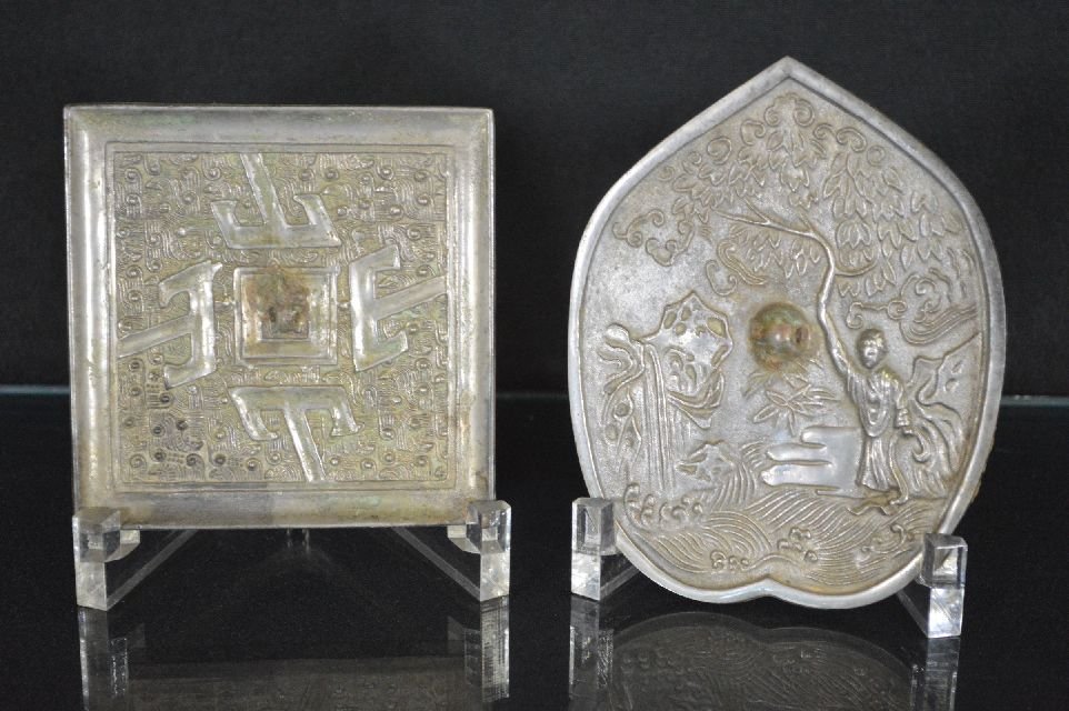 a pair of Chinese metal mirrors: square shape mirror and a peach shape mirror, one with geometry design, and other with scene of garden. Square mirror is 4.5"x4.5"