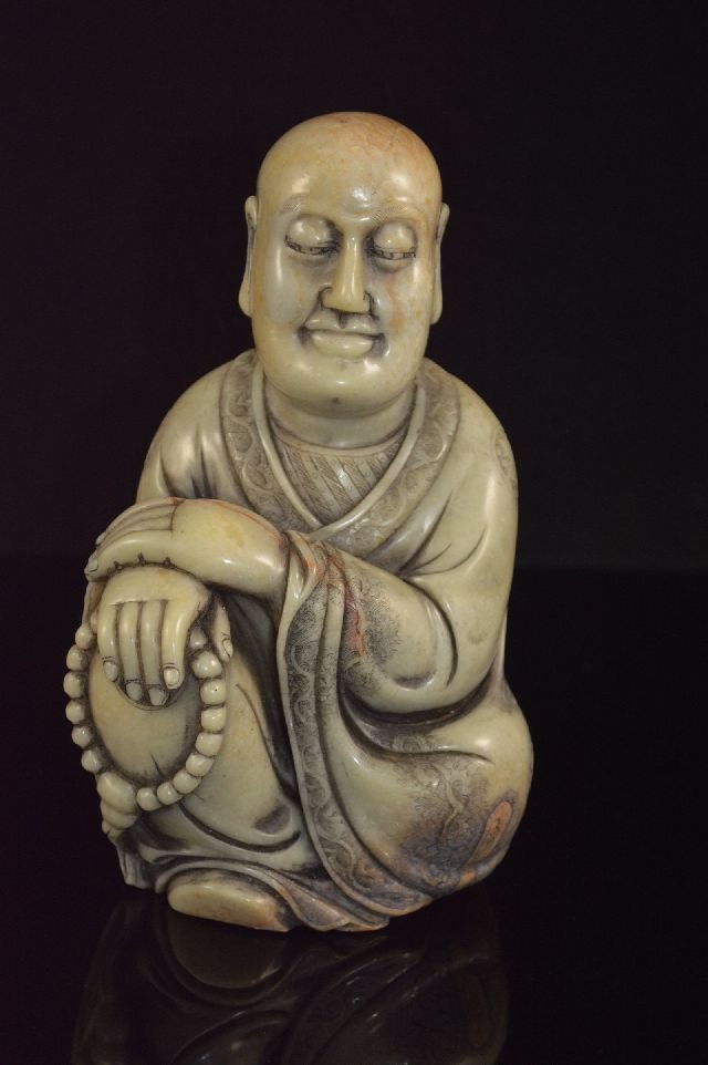 carved soapstone Buddha: a Buddha setting, right hand hold a prayer beads. 6"T