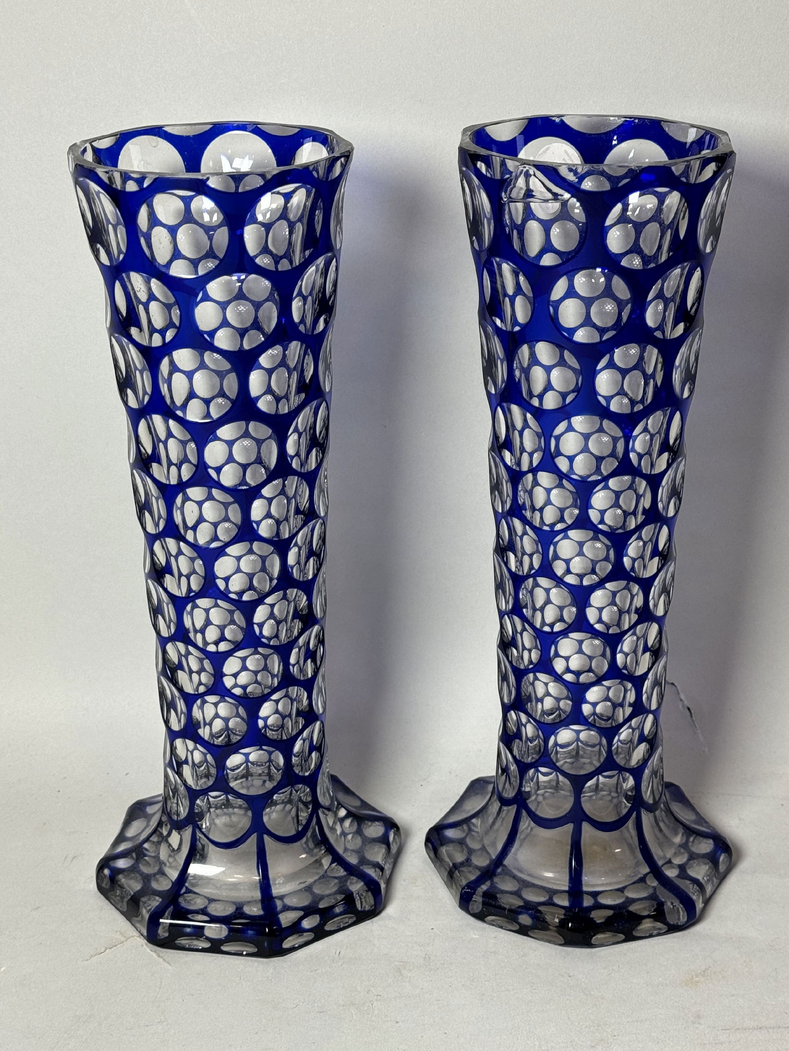 A PAIR OF BLUE CUT TO CLEAR VASES, 4.5" DIAMETER X 11" TALL. RIM CHIPS (1 of 13)