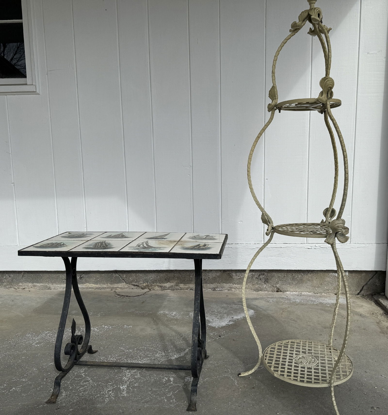 A WROUGHT IRON PLANT STAND AND A TILE TOP TABLE WITH SAILBOATS, 16" DIAMETER X 52" TALL AND 25" X (1 of 3)