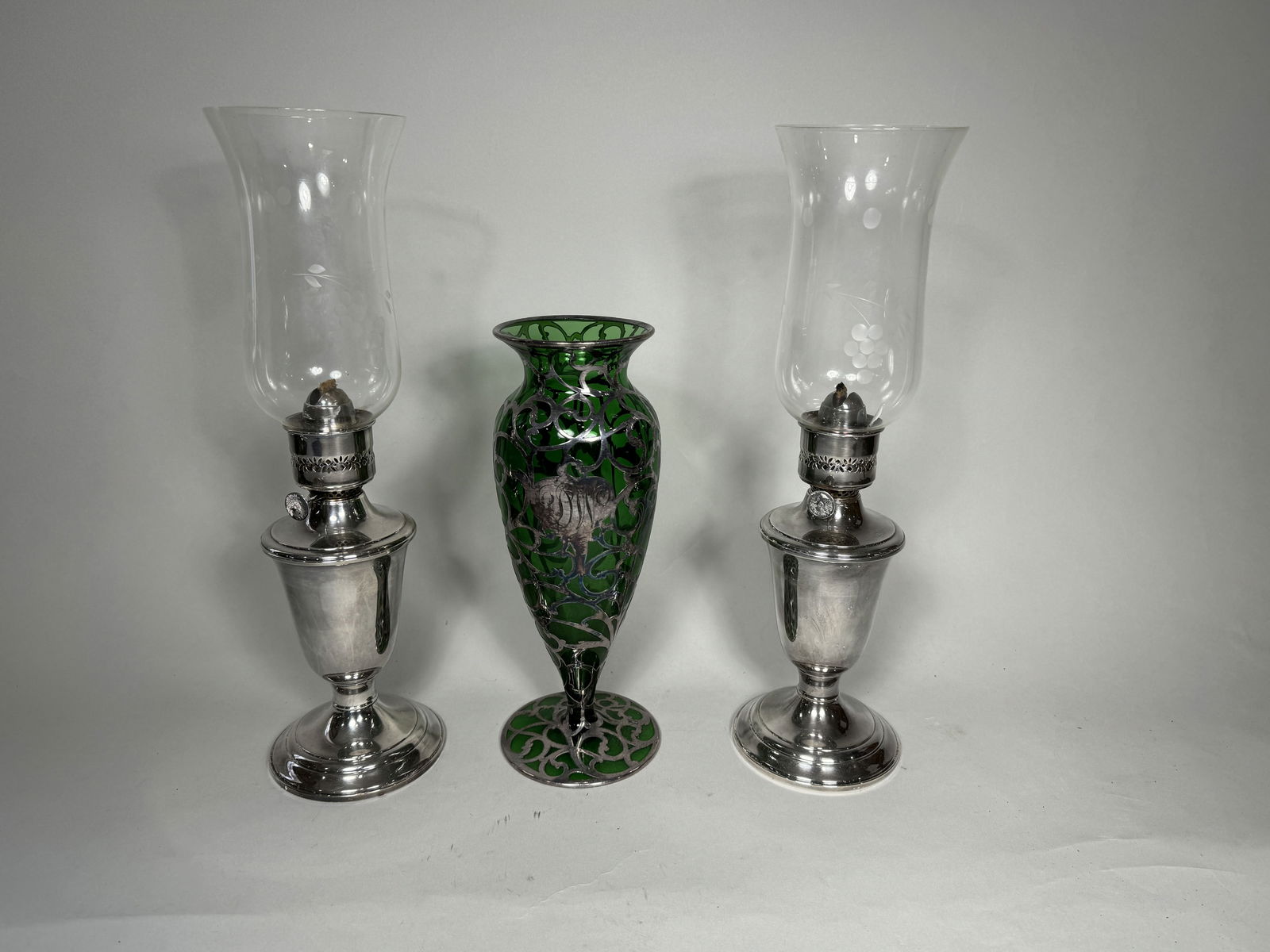 A PAIR OF SILVERPLATE OIL LAMPS AND A STERLING OVERLAY VASE, 10" AND 14" (1 of 5)