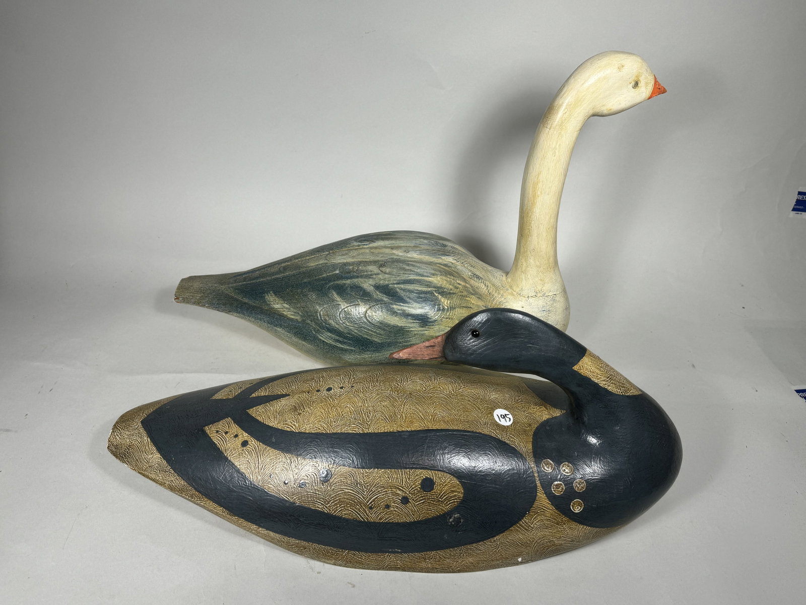 TWO LARGE FOLK CARVED BIRDS, A SWAN AND A CANADIAN GOOSE: TWO LARGE FOLK CARVED BIRDS, A SWAN AND A CANADIAN GOOSE