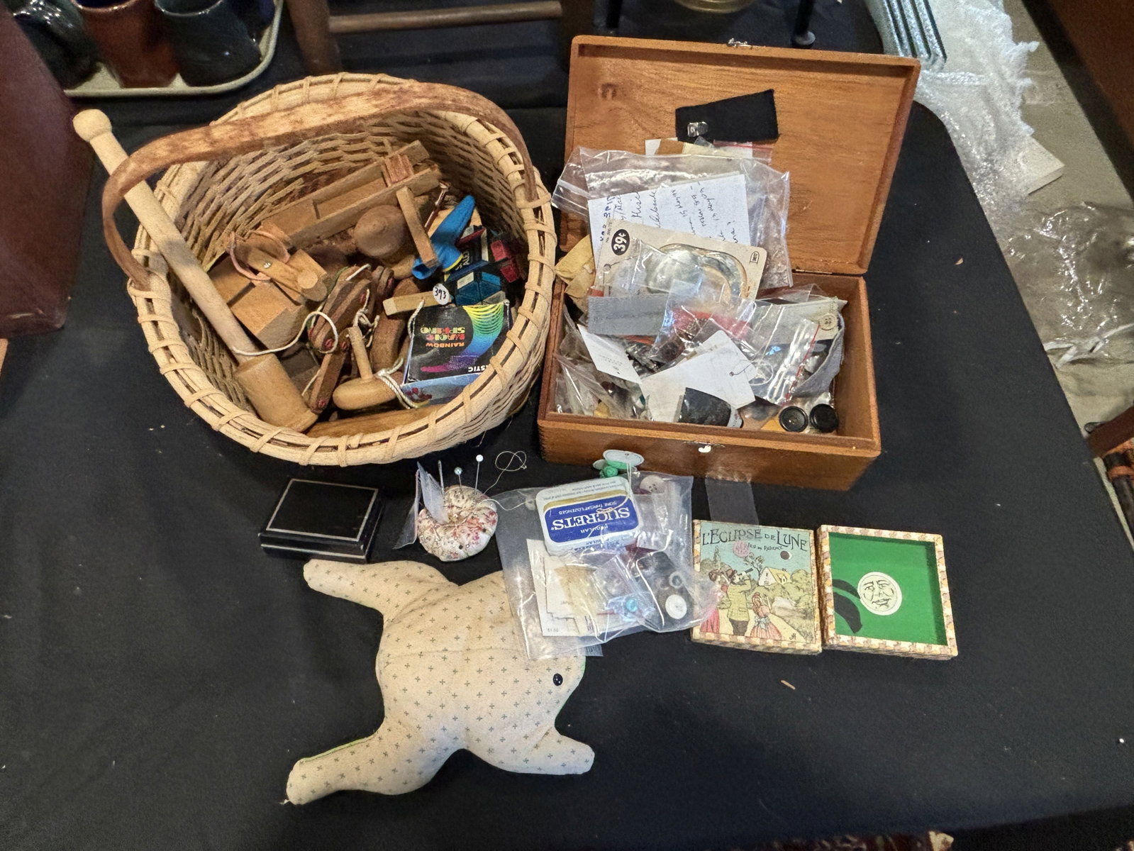 A BOX OF SEWING NOTIONS AND A BASKET OF KIDS TOYS, 12" X 13" AND SMALLER: A BOX OF SEWING NOTIONS AND A BASKET OF KIDS TOYS, 12" X 13" AND SMALLER