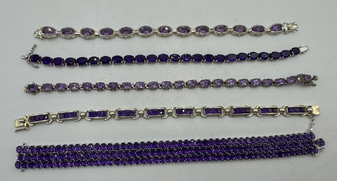 FOUR STERLING SILVER BRACELETS W/ AMETHYST COLORED STONES (1 of 1)