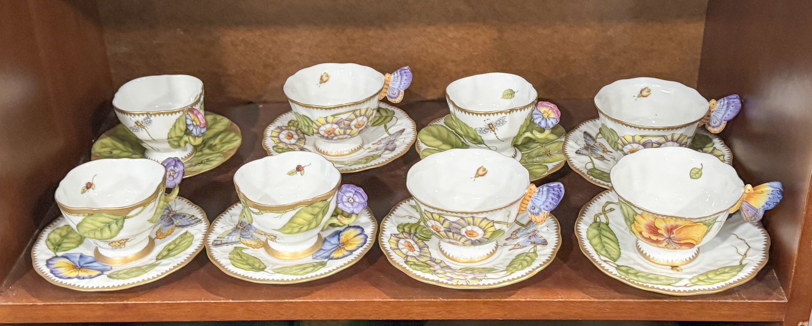 EIGHT ANNA WEATHERLEY PORCELAIN CUPS AND SAUCERS: EIGHT ANNA WEATHERLEY PORCELAIN CUPS AND SAUCERS