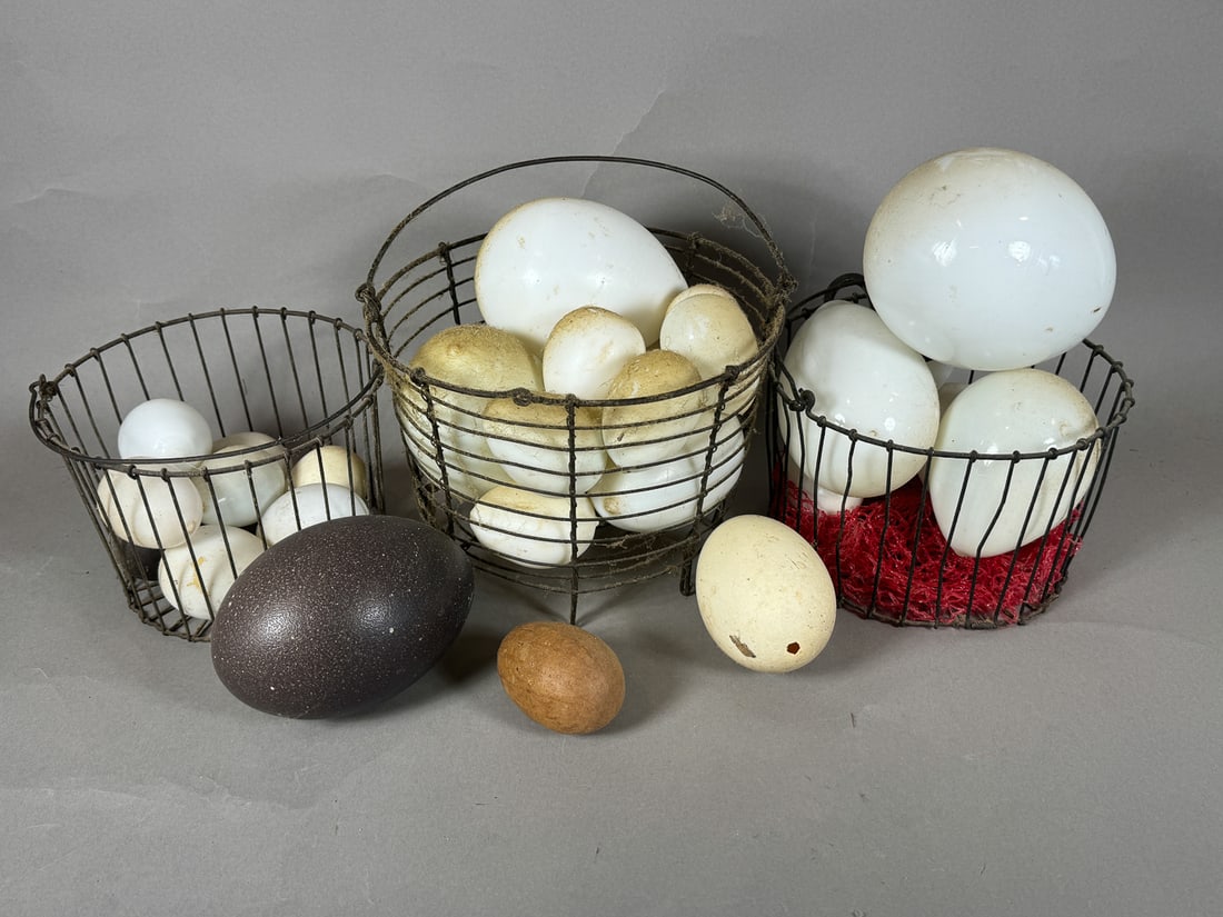 THREE WIRE BASKETS FULL OF ANTIQUE GLASS DARNING EGGS AND ONE OSTRICH EGG, 8" AND SMALLER (1 of 5)