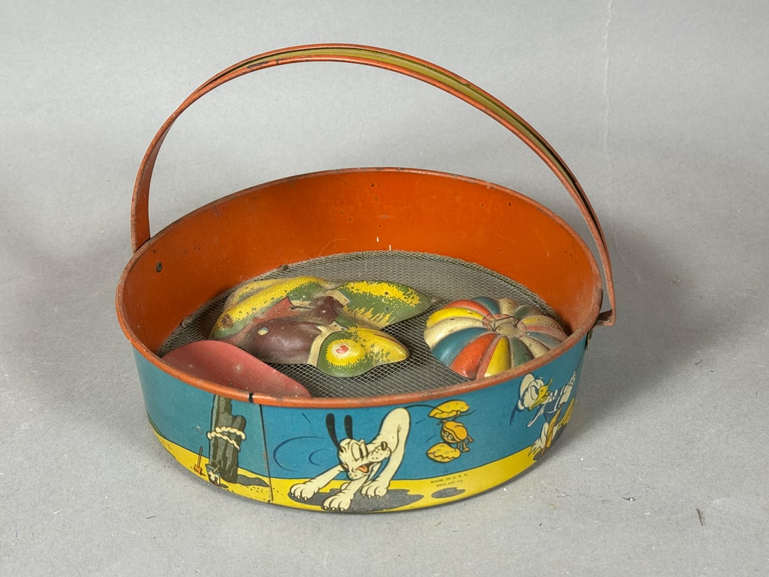 A TIN LITHOGRAPH DONALD DUCK BEACH SET, 8" DIAMETER X 7" TALL (1 of 4)