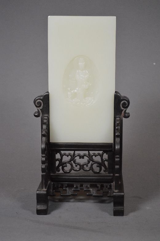 Carved jade table screen: jade table screen, china, carved with Guanyin on surface, with Zitan wood stand. 10 1/2" x 6" with stand